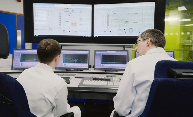 Two scientists working in Imperial's Carbon Capture Pilot Plant