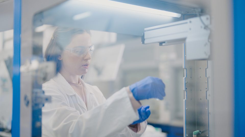 An ICAM researcher conducting an experiment in the lab