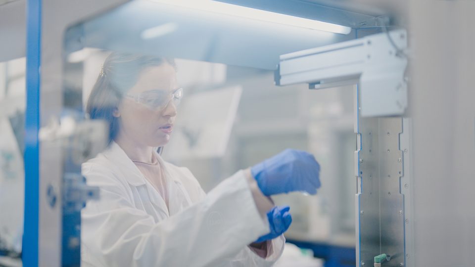 Researcher conducting lab experiments